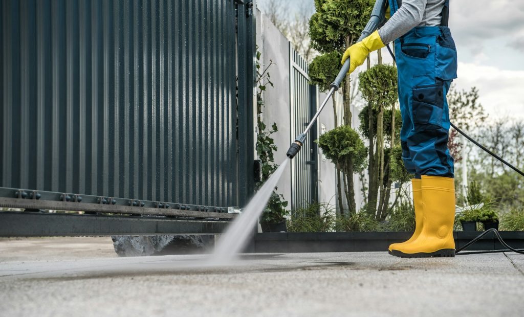 Man Washing the Driveway