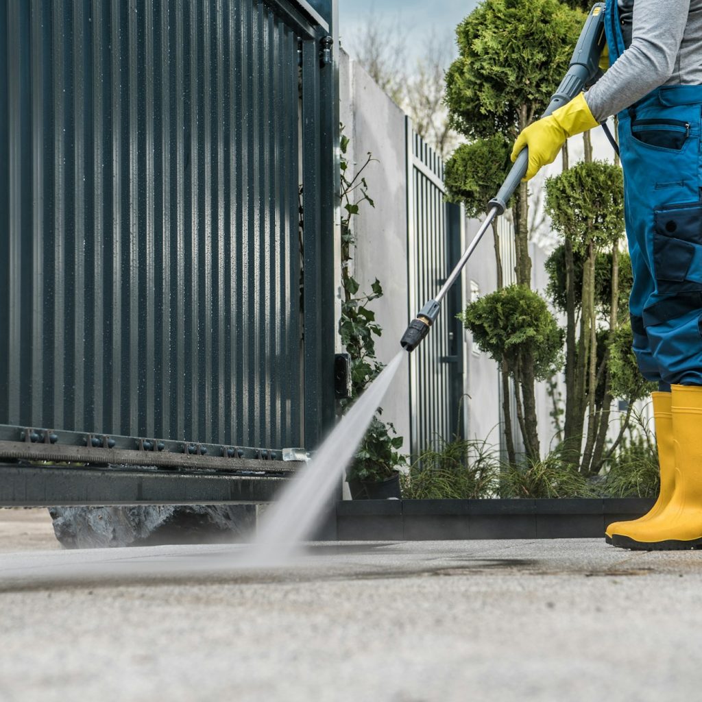 Man Washing the Driveway